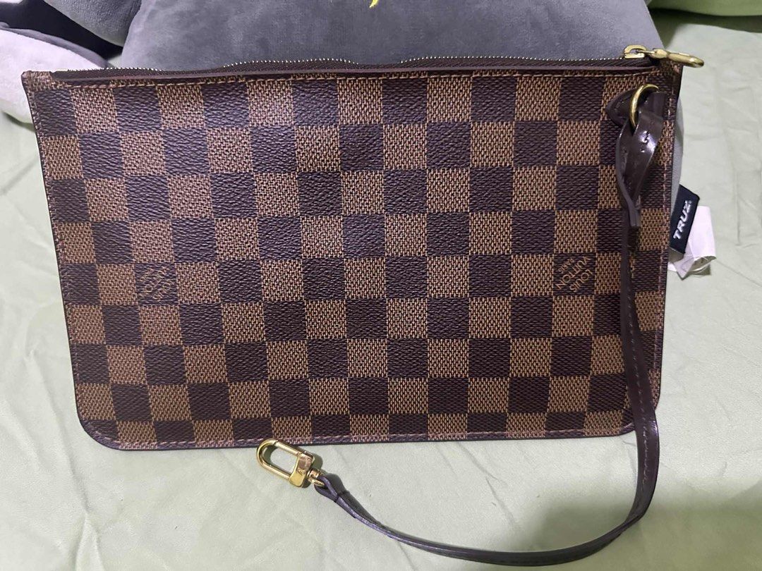 Louis Vuitton 2017 Damier Ebene Pochette Clutch (Category: Luxury Bags & Wallets) located in Manila. Submitted by numee (Listing ID 1402870783, Image 1). Description: - Authentic Louis Vuitton Pochette Clutch - Iconic Damier Ebene canvas - Secure zip closure - Interior lined with red fabric - Features a wrist strap with gold-tone clasp - Made in Spain Barely used, like new. Price is negotiable though lowballing will not be accepted nor entertaine
