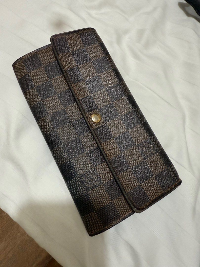 LV wallet (Category: Luxury Bags & Wallets) located in Quezon City. Submitted by MJ_declutters (Listing ID 1402883339, Image 1). Description: pre-loved 101% authentic with box and dust bag.