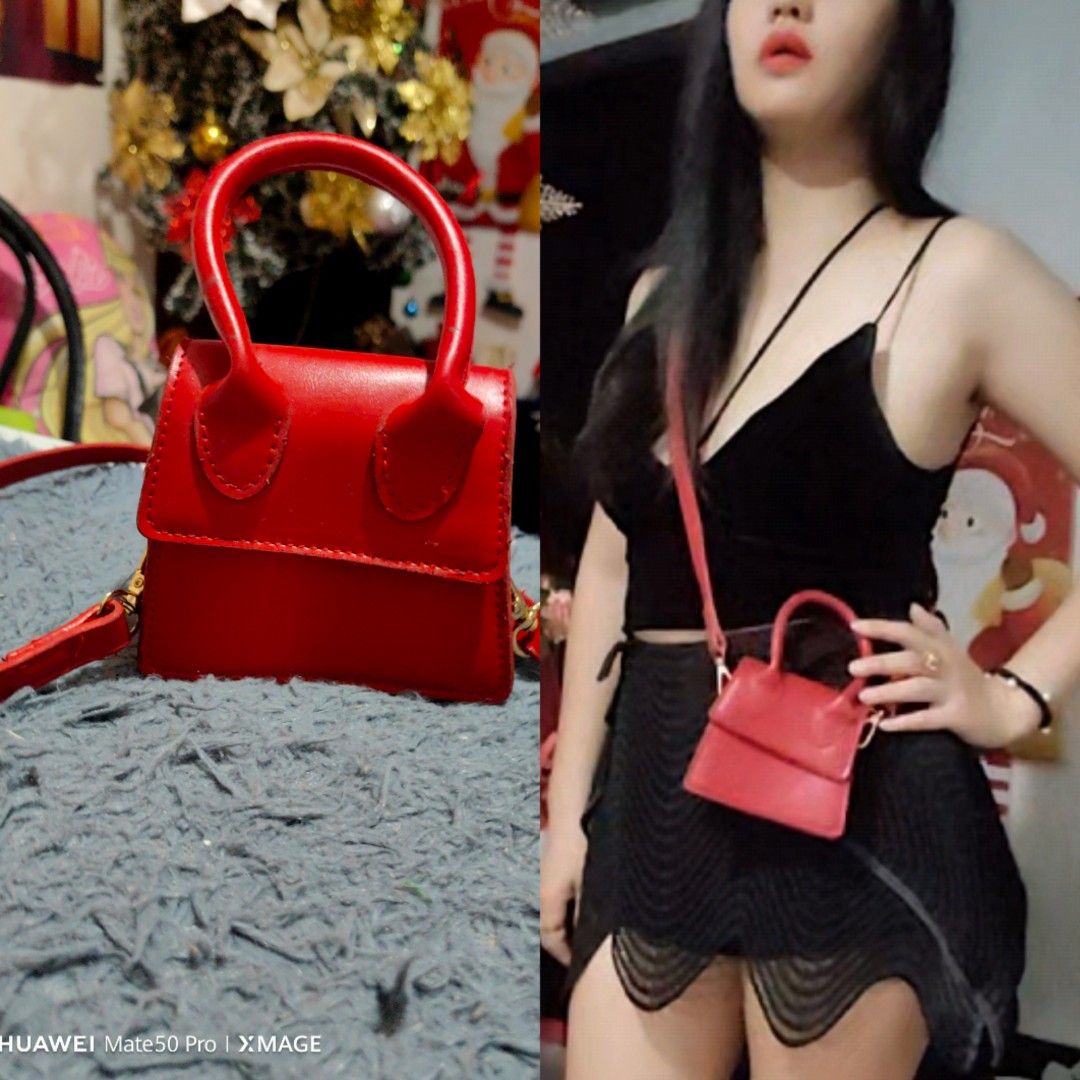 Mini Red Handbag with Top Handle (Category: Luxury Bags & Wallets) located in Villasis. Submitted by mysticforest.bb2b4b (Listing ID 1402847517, Image 2). Description: Mini handbag features a top handle and a detachable crossbody strap. It is a vibrant red color and has a rectangular shape. It's a stylish accessory for various occasions. The bag is small and compact, perfect for carrying essentials..