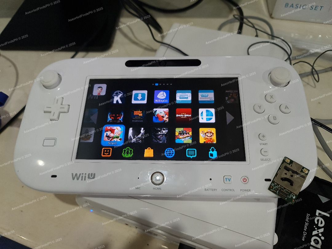 Modded Wii U Basic Set 8GB + 128GB SSD with Box (READ DESCRIPTION) (Category: Nintendo) located in Quezon City. Submitted by assortedfindsph (Listing ID 1402885691, Image 2). Description: "Post will be marked as sold once sold." Selling my Wii U Used but not abused. 6,7k (Fixed Price) Questions like “Is this available?”, “LP?”, or anything already stated in the description will be ignored. Model: Basic Set 8GB Bought in Kyoto, Japan 🇯🇵 last yea