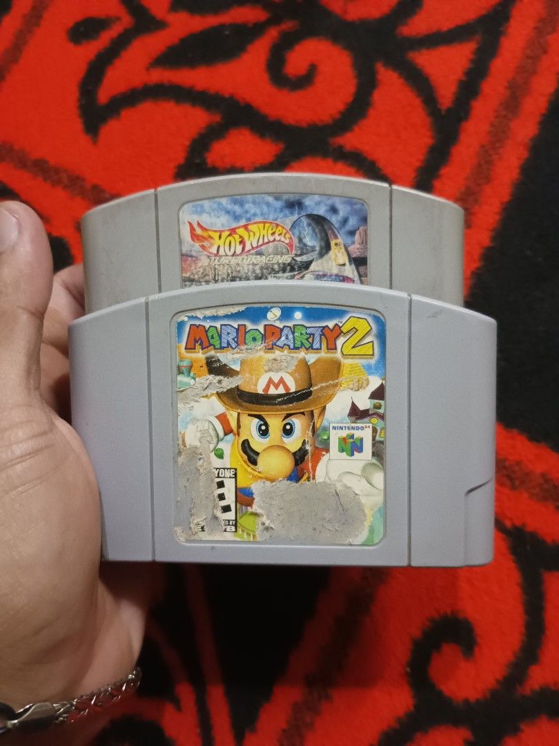 N64 Mario party 2 and Hotwheeels (Category: Nintendo) located in Quezon City. Submitted by markgolveo (Listing ID 1402887736, Image 1). Description: N64 Mario party 2 and Hotwheeels NA game carts untested units.