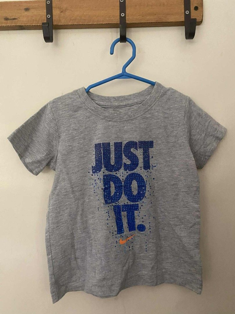 Nike Just Do It T-shirt Kids (Category: Babies & Kids Fashion) located in Angeles City. Submitted by randomgoodies_ (Listing ID 1402877564, Image 1). Description: - Nike "JUST DO IT" t-shirt - Color: Gray - Graphic: Blue text and orange Nike logo - Size 3T.