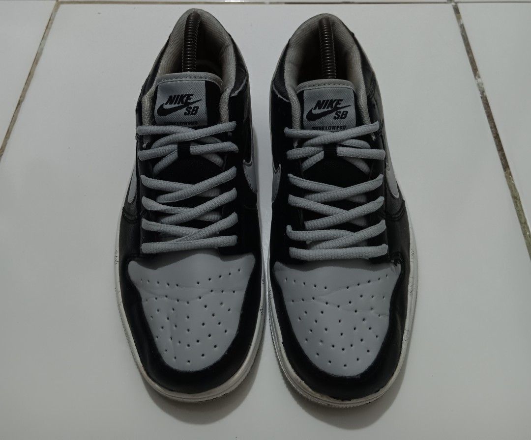 Nike SB Dunk Low Black Grey (Category: Sneakers) located in Dauis. Submitted by udenglegaspi (Listing ID 1402972254, Image 3). Description: - Nike SB Dunk Low - Black and grey colorway - Leather upper - Grey toe box and side panels - Grey Nike swoosh - White sole with grey outsole - Grey laces - Nike SB tongue logo.