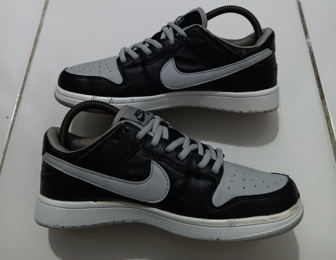 Nike SB Dunk Low Black Grey (Category: Sneakers) located in Dauis. Submitted by udenglegaspi (Listing ID 1402972254, Image 2). Description: - Nike SB Dunk Low - Black and grey colorway - Leather upper - Grey toe box and side panels - Grey Nike swoosh - White sole with grey outsole - Grey laces - Nike SB tongue logo.