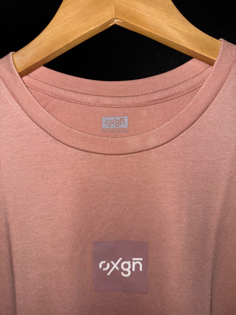 Oxgn Pink T-shirt (Category: Shirts) located in Hermosa. Submitted by xonarchive (Listing ID 1402894297, Image 2). Description: - Asian Sizing - Oxgn pink t-shirt - Small square logo on chest - Brand label on neckline - Short sleeves - Crew neck - Soft, comfortable fabric.