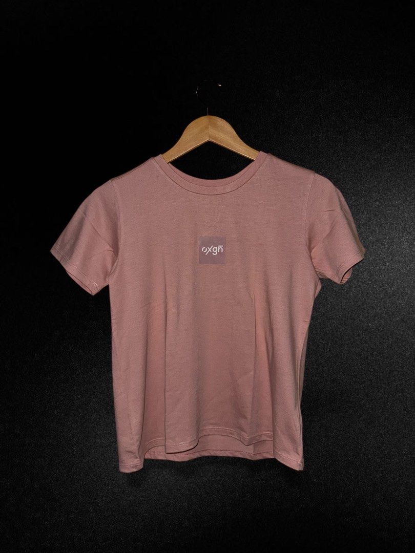 Oxgn Pink T-shirt (Category: Shirts) located in Hermosa. Submitted by xonarchive (Listing ID 1402894297, Image 1). Description: - Asian Sizing - Oxgn pink t-shirt - Small square logo on chest - Brand label on neckline - Short sleeves - Crew neck - Soft, comfortable fabric.