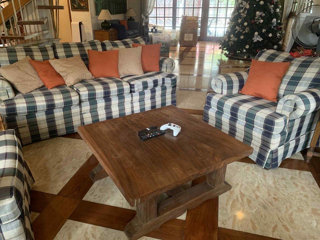 Plaid Sofa and Armchairs Set (Category: Sofas) located in Manila. Submitted by dpw_angel (Listing ID 1402970612, Image 3). Description: - Classic plaid sofa and armchair set - Includes a three-seater sofa and two armchairs - Comes with throw pillows in neutral and orange tones - Features rolled arms and skirted bases - Perfect for adding elegance to your living room.