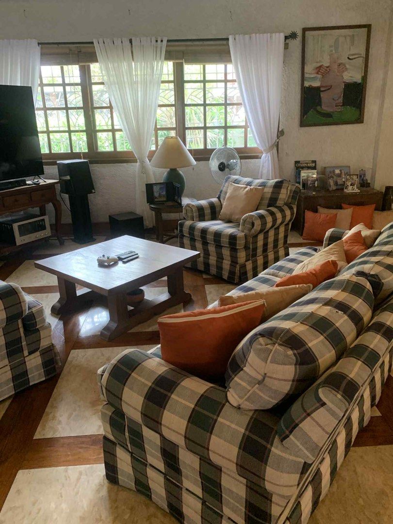 Plaid Sofa and Armchairs Set (Category: Sofas) located in Manila. Submitted by dpw_angel (Listing ID 1402970612, Image 1). Description: - Classic plaid sofa and armchair set - Includes a three-seater sofa and two armchairs - Comes with throw pillows in neutral and orange tones - Features rolled arms and skirted bases - Perfect for adding elegance to your living room.