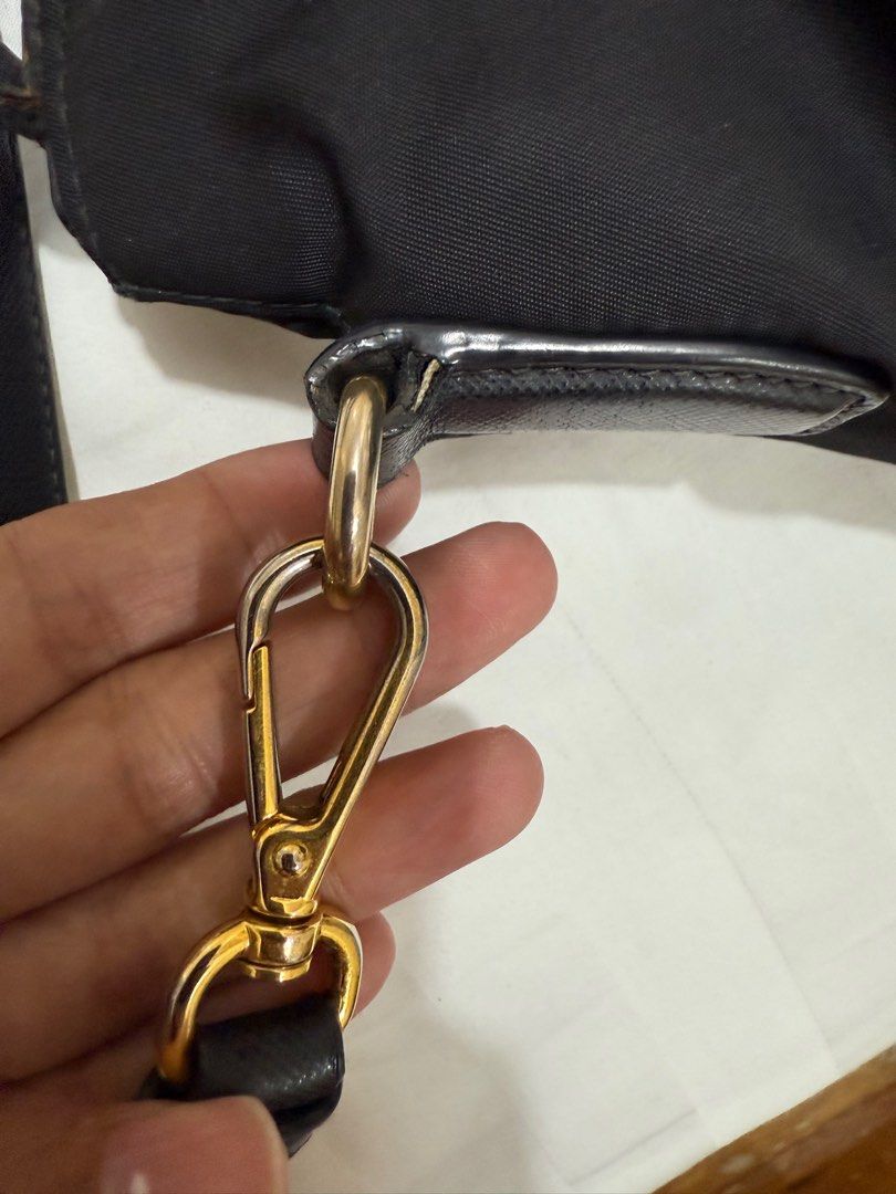 Prada Nylon 2-way bag (Category: Cross-body Bags) located in Quezon City. Submitted by MJ_declutters (Listing ID 1402971708, Image 3). Description: pre-loved negotiable 101% original with generic dust bag.