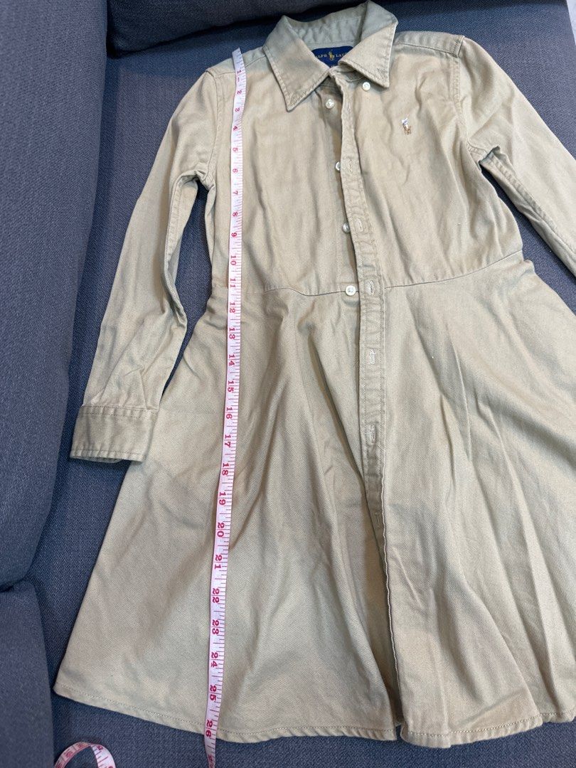 Ralph Lauren Dress - Size 6X (Category: Babies & Kids Fashion) located in Paranaque City. Submitted by lalafer (Listing ID 1402956019, Image 3). Description: - Ralph Lauren dress (belt not included) - Light tan color - Size 6X - Button-down style - Collared neckline - Long sleeves - Fitted bodice with pleated skirt - Ralph Lauren logo on chest.