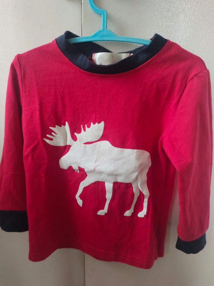 Red Long Sleeve Shirt with Moose Design (Category: Babies & Kids Fashion) located in Imus. Submitted by saritacaredandpreloved (Listing ID 1403035327, Image 1). Description: - Red long sweater - White moose design on front - Navy blue collar and cuffs - Soft and comfortable material - Perfect for casual wear - Christmas wear.
