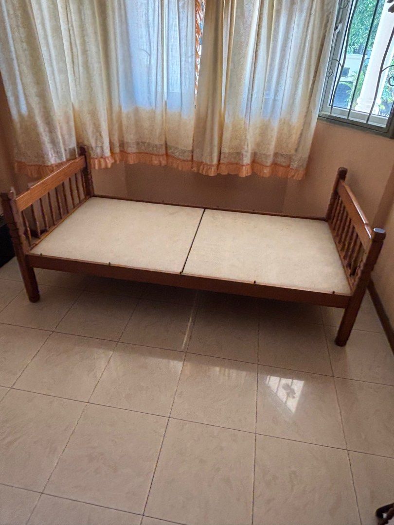 Solid Pine Wood Single Bed Frame (Category: Bed Frames & Mattresses) located in Singapore. Submitted by jash.jothies (Listing ID 1402851703, Image 1). Description: - Solid Pine wood single bed frame - Classic design - Features a slatted base - Perfect for guest room or child's bedroom - Mattress not included Pick up in Serangoon area..