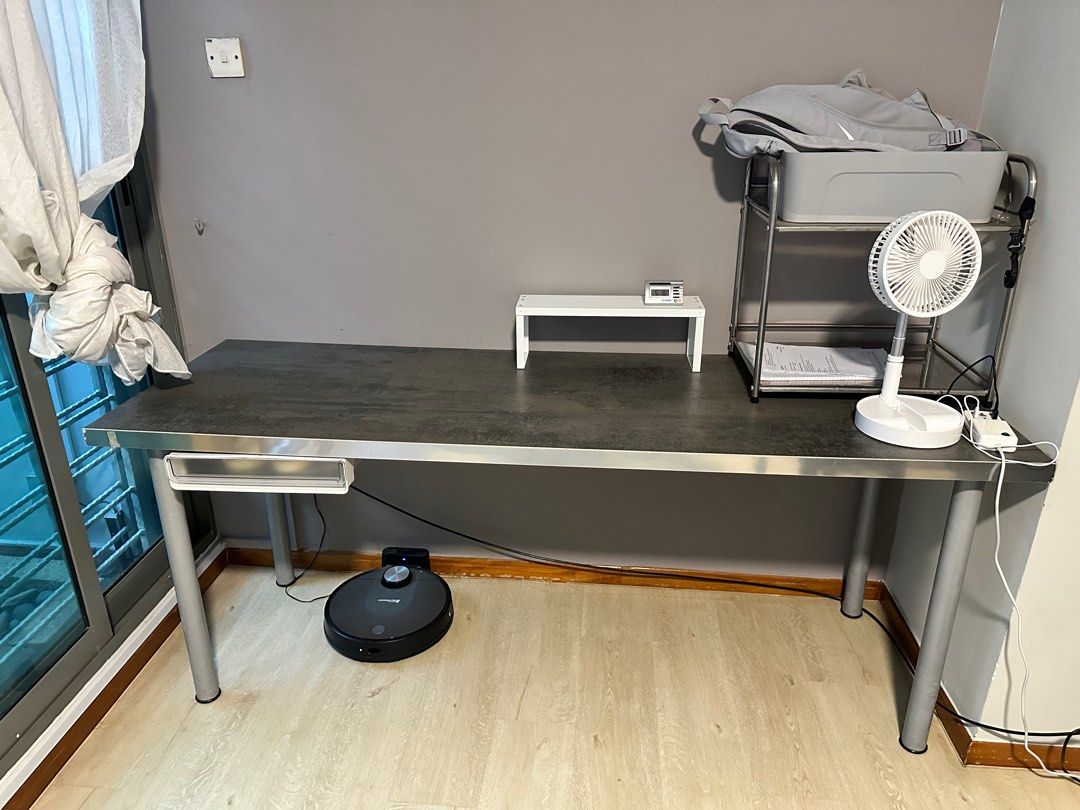 Study or work table (Category: Tables & Sets) located in Singapore. Submitted by crazyaboutbikes (Listing ID 1402993252, Image 1). Description: - heavy and solid table - detachable metal legs - attached drawer for storage - Perfect for home office/study - Dimensions: 1.86m x 0.62m Note. Only the table. Does not include the rest of the items on the table. .