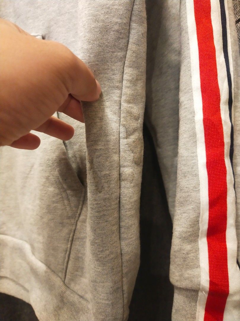 Thom Browne New York Hoodie (Category: Coats, Jackets and Outerwear) located in Quezon City. Submitted by markythegrappler17 (Listing ID 1402937977, Image 3). Description: Thom Browne -Size 2 -Dimes 20W/26L -Excellent Condition -9/20 Condition -Color grey -washable stain on side -Stripe design by Thom Browne on side .