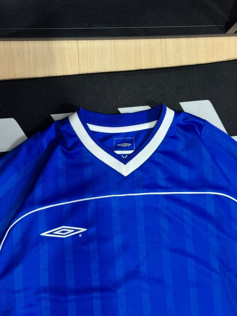 Umbro Vapa Tech Jersey - Blue (Category: Activewear) located in Cavite. Submitted by wydecollection (Listing ID 1403017756, Image 2). Description: - Official Umbro Vapa Tech jersey - Color: Blue - Features: V-neck collar with white trim, Umbro logo - Back: Number 7 - Size: M (GB, EUR, USA) / L (Asia) - Made in China Excellent Condition.