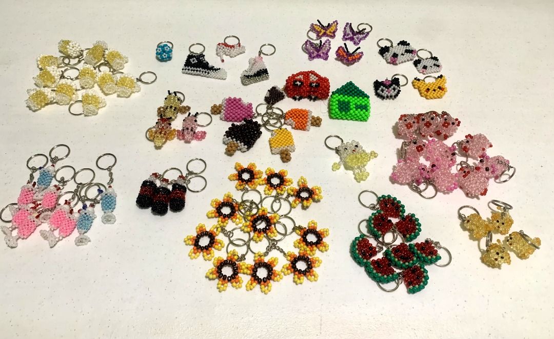 UNIQUE KEYCHAINS - IDEAL GIFTS (Category: Handmade Craft) located in Manila. Submitted by jode.leon (Listing ID 1402861713, Image 1). Description: - Unique, handmade keychains. - Features various designs: animals, food, shoes, and more. - Made with colorful beads. - Ideal as gifts or personal accessories..