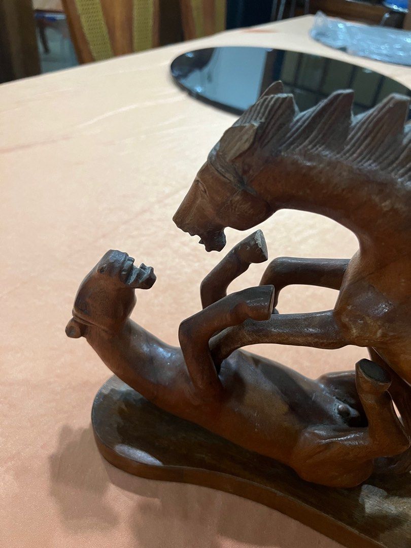 Wooden Horse Sculpture (Category: Other Home Decor) located in Paranaque City. Submitted by mariafernandez917 (Listing ID 1402921132, Image 2). Description: Elegant hand-carved wooden sculpture depicting two horses in motion — a unique and expressive piece perfect for rustic or vintage interiors. Crafted from solid hardwood with fine detailing and smooth polish. A beautiful collectible or statement décor piece. Material: Solid wood (likely mahoga