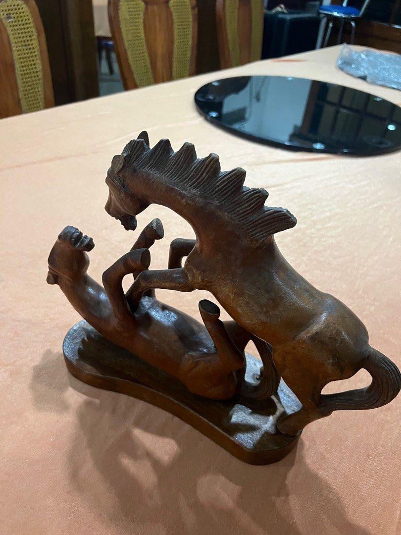 Wooden Horse Sculpture (Category: Other Home Decor) located in Paranaque City. Submitted by mariafernandez917 (Listing ID 1402921132, Image 3). Description: Elegant hand-carved wooden sculpture depicting two horses in motion — a unique and expressive piece perfect for rustic or vintage interiors. Crafted from solid hardwood with fine detailing and smooth polish. A beautiful collectible or statement décor piece. Material: Solid wood (likely mahoga