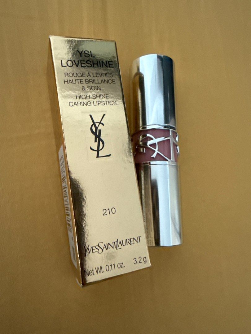 YSL Loveshine High-Shine Caring Lipstick - 210 (Category: Makeup) located in Makati City. Submitted by somethingownedbyme (Listing ID 1402845224, Image 1). Description: - YSL Loveshine Caring Lipstick - Shade: 210 - High-shine finish - Original packaging - Net weight: 0.11 oz / 3.2g - Features YSL logo.