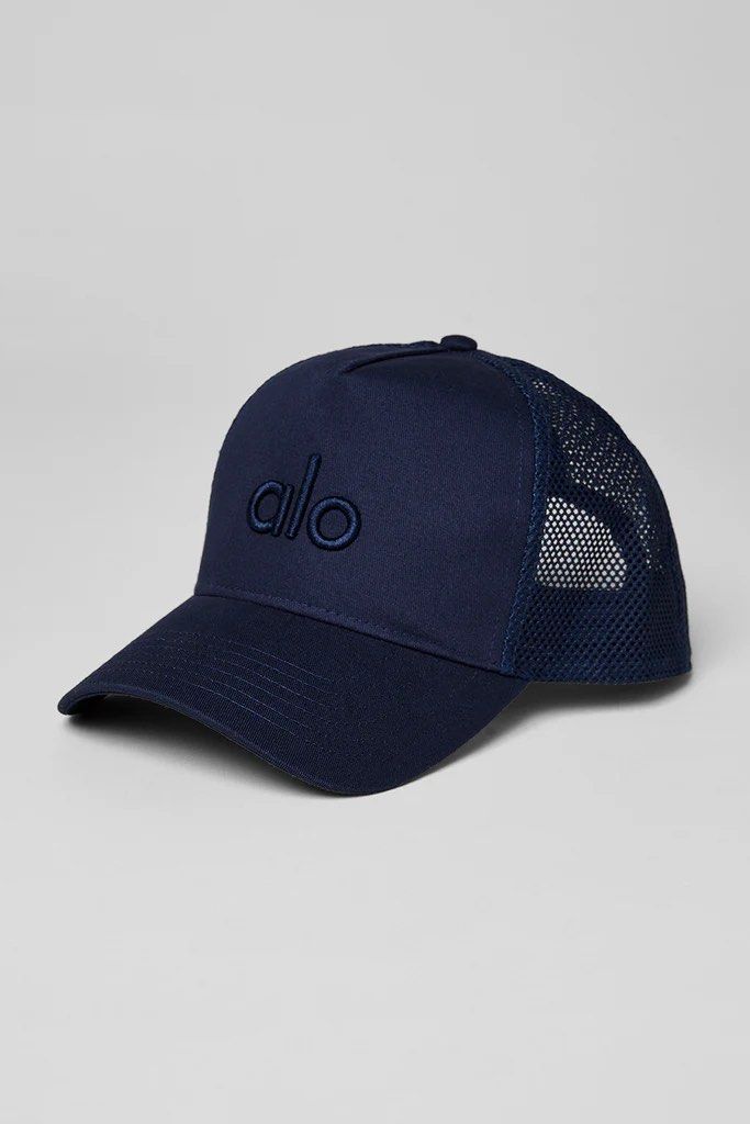 Alo Navy Trucker Cap (Category: Caps & Hats) located in Singapore. Submitted by gkluxstyle (Listing ID 1403175380, Image 1). Description: - Alo navy trucker cap - Mesh back for breathability - Embroidered Alo logo - Adjustable snapback closure - Suitable for workouts and casual wear.