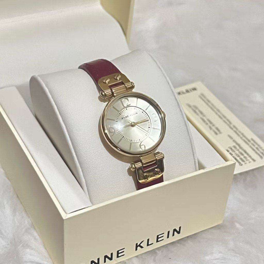 Anne Klein faux leather watch (Category: Women's Watches) located in Manila. Submitted by jnlldp (Listing ID 1403070911, Image 2). Description: Brand new and from the US. Slightly domed mineral crystal lens; glossy cream dial with black hands and Roman numerals; printed inner minute track Red leather strap with buckle closure Japanese-quartz Movement Case Diameter: 28mm Water Resistant To 99 Feet Description A timeless classic, this leather strap
