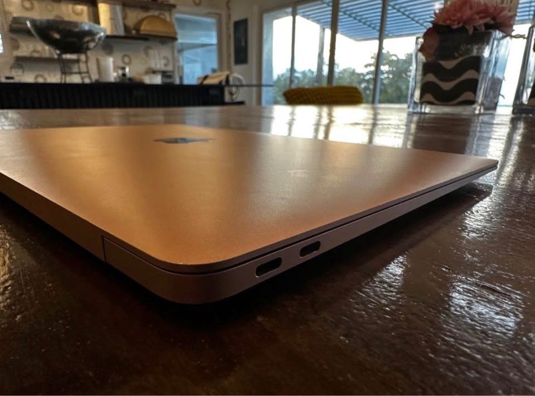 Apple Macbook Air 13-inch 2019 (Category: Laptops & Notebooks) located in Makati City. Submitted by michelle1208 (Listing ID 1403082995, Image 3). Description: Apple Macbook Air 13-inch 2019 model. Features a Retina display and is powered by an Intel Core i5 processor with 8GB of RAM. It has a 256GB storage. The laptop has a silver finish. The images show the laptop's exterior and some minor wear on the edges..