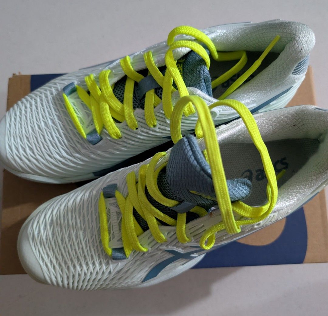 Asics Solution Speed FF Tennis Shoes (Category: Sneakers) located in Singapore. Submitted by simonwisdom (Listing ID 1403185711, Image 3). Description: Brand new Asics Solution Speed FF tennis shoes. Features a light blue and white colorway with neon yellow laces. Comes with the original box. Perfect for tennis players looking for performance and style..