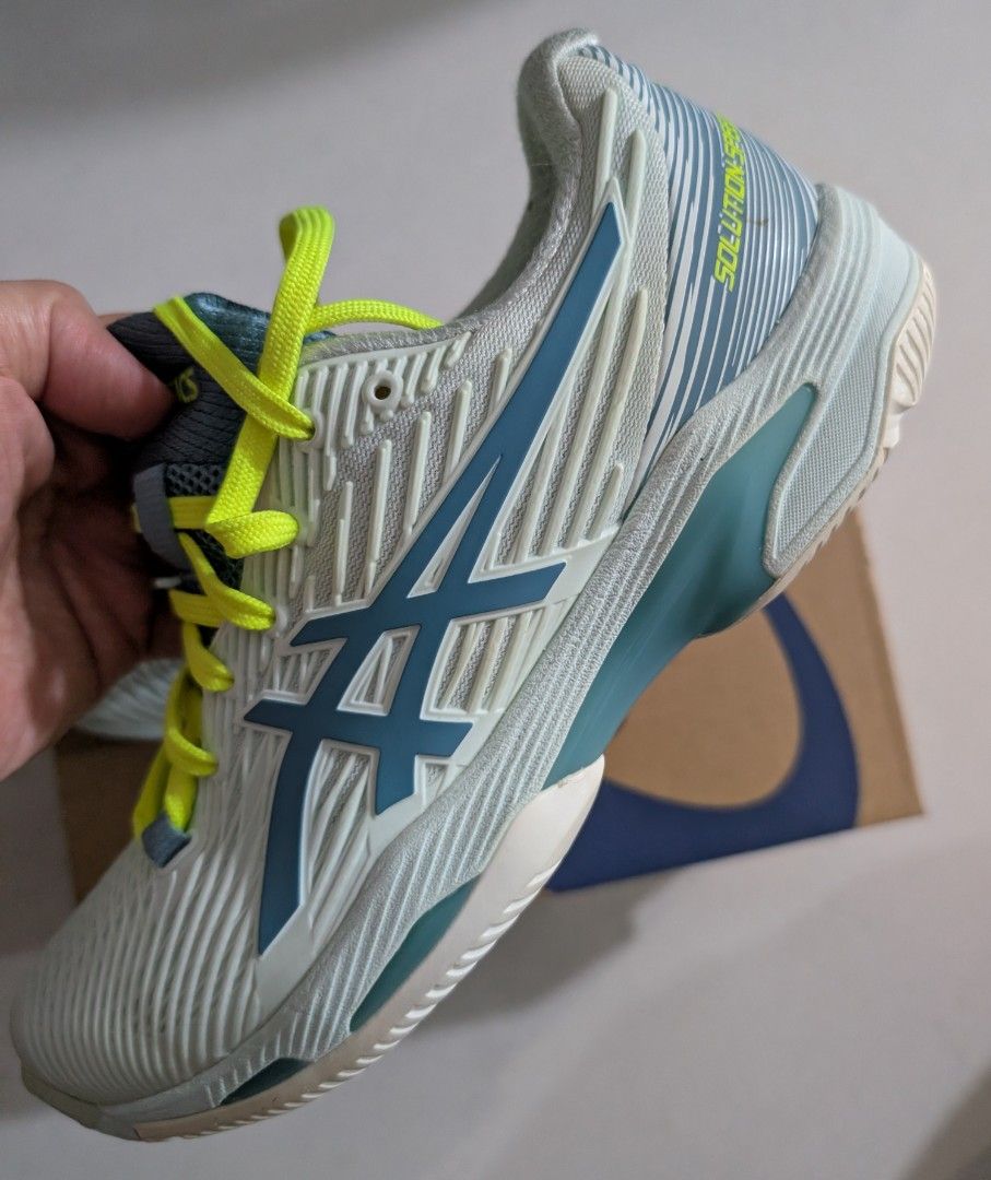 Asics Solution Speed FF Tennis Shoes (Category: Sneakers) located in Singapore. Submitted by simonwisdom (Listing ID 1403185711, Image 1). Description: Brand new Asics Solution Speed FF tennis shoes. Features a light blue and white colorway with neon yellow laces. Comes with the original box. Perfect for tennis players looking for performance and style..