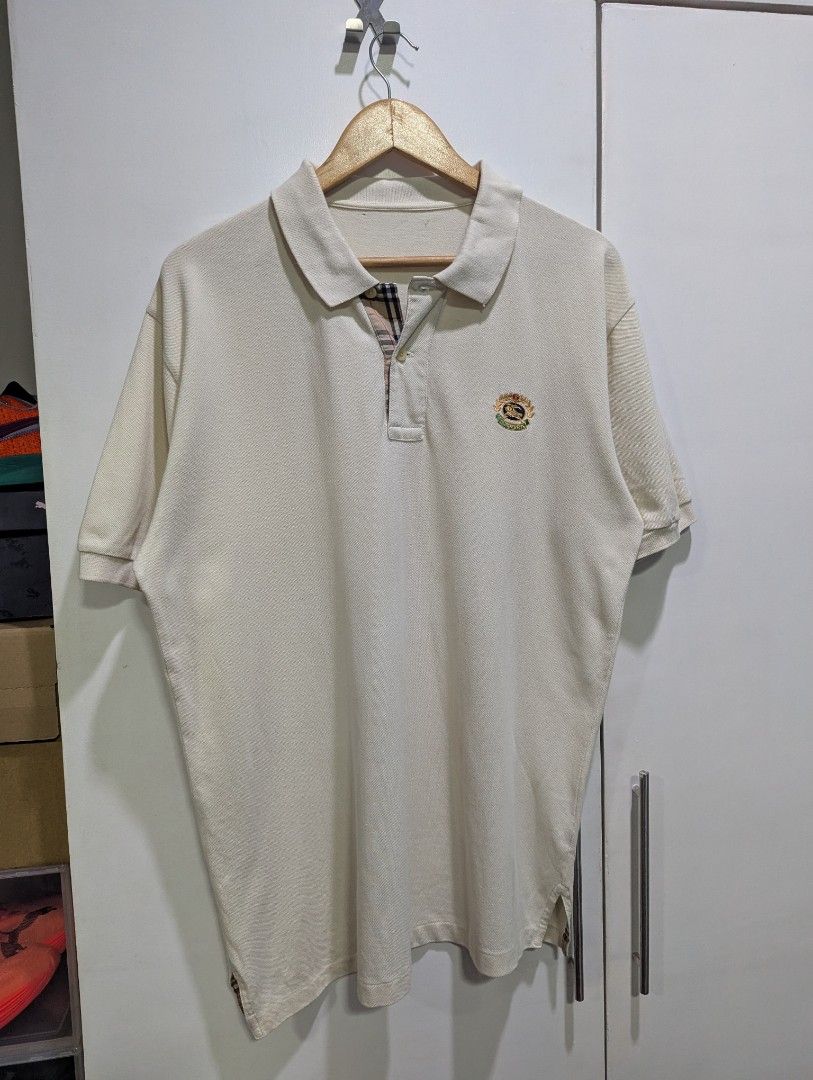 Burberry Polo Shirt (Category: Tshirts & Polo Shirts ) located in Quezon City. Submitted by lancelooot (Listing ID 1403181050, Image 1). Description: - Burberry cream polo shirt - Embroidered logo on chest - Signature Burberry check collar - Two-button placket - Short sleeves -cut tags.