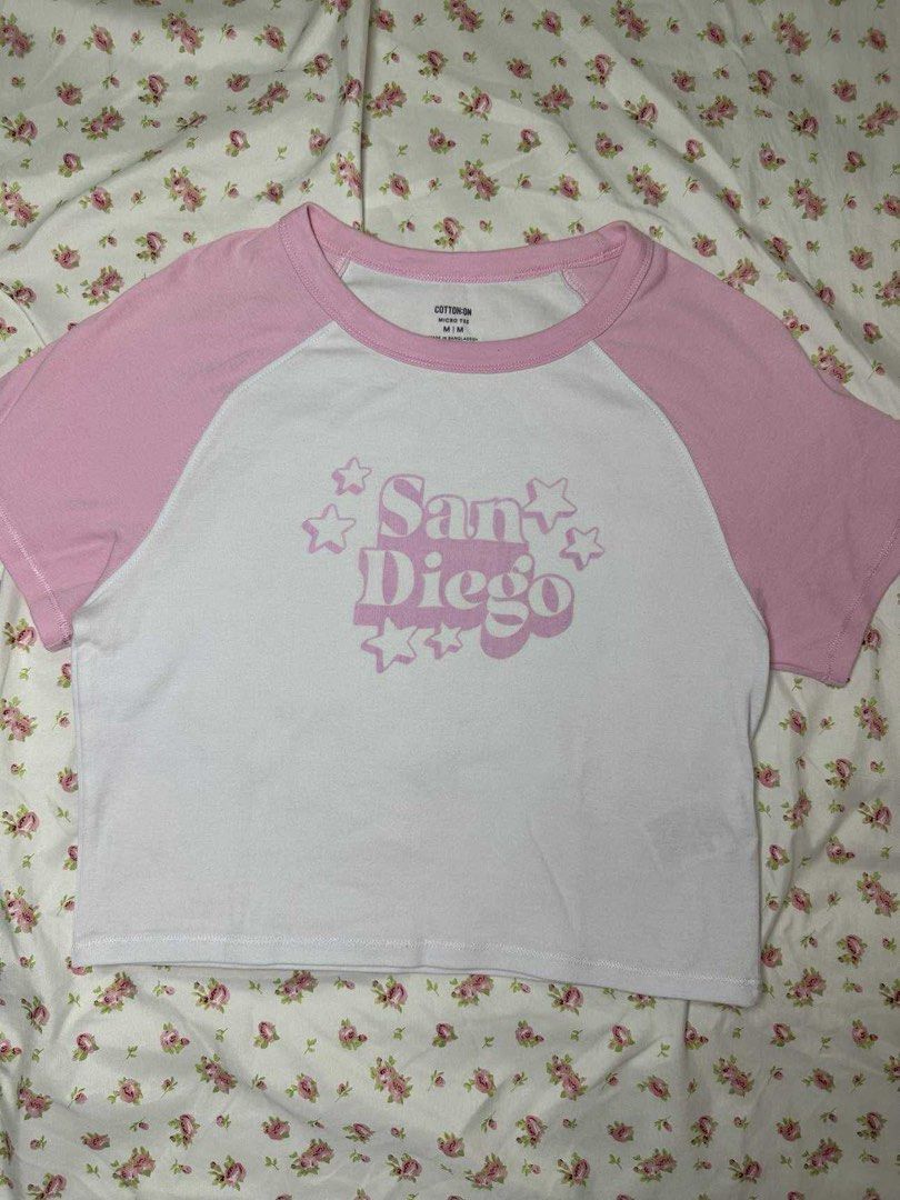 Cotton On San Diego Crop Top (Category: Shirts) located in Mandaluyong City. Submitted by bch2009 (Listing ID 1403214963, Image 1). Description: - Cotton On crop top - White body with pink sleeves - Features a pink San Diego graphic - Round neckline - stretchy fabric - og price ₱899 mode of payment is gcash mode of delivery is lalamove or grab.