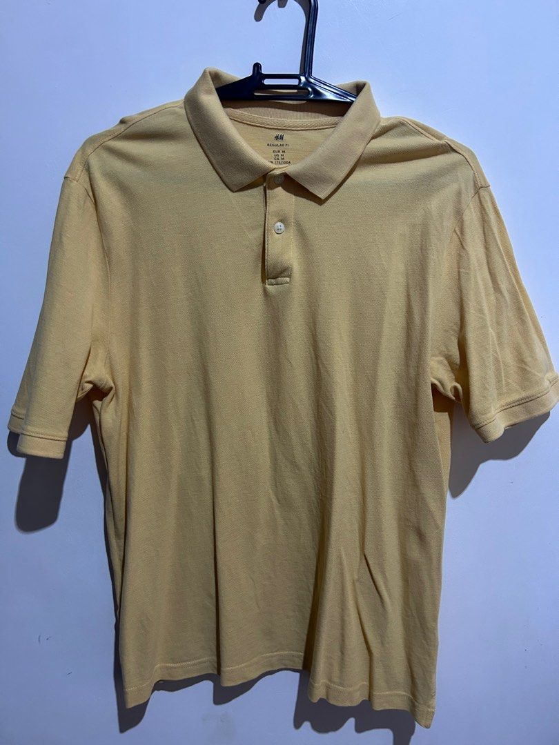 H&M Regular Fit Polo Shirt - Yellow - Medium (Category: Tshirts & Polo Shirts ) located in Taguig. Submitted by kapetaio (Listing ID 1403094887, Image 1). Description: - H&M yellow polo shirt - Regular Fit, Medium size - Classic polo collar - Short sleeves - Made in Bangladesh - Cotton fabric - Three-button placket.