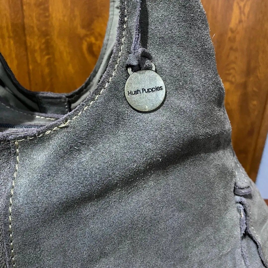 Hush Puppies Suede Hobo Bag (Category: Shoulder Bags) located in Baguio. Submitted by nrcoline (Listing ID 1403083788, Image 2). Description: Hùsh Pùppies shoulder bag size medium Gamuza leather material Makapal & malinis W/ side magnet lock pockets W/ front & back magnet lock pockets No flaws, no kupas.