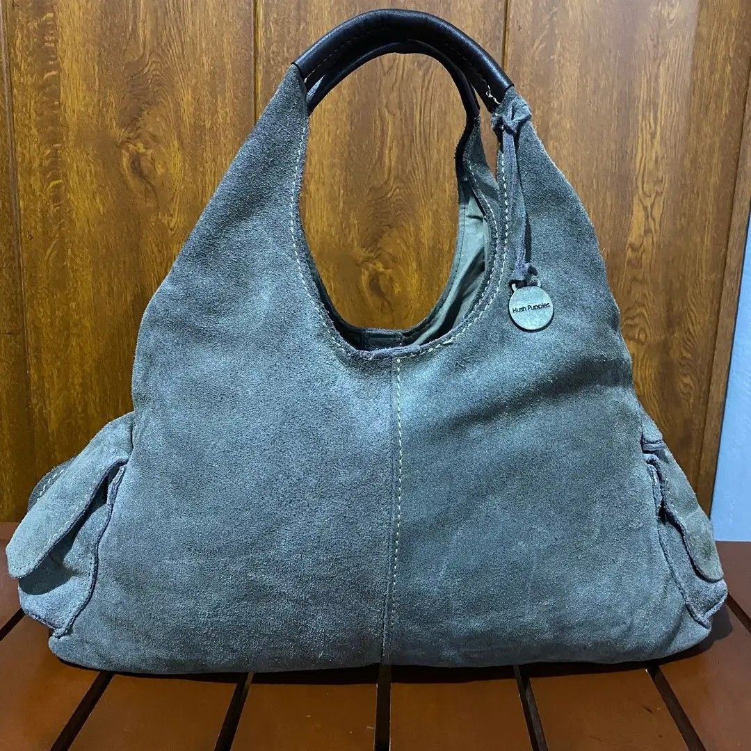 Hush Puppies Suede Hobo Bag (Category: Shoulder Bags) located in Baguio. Submitted by nrcoline (Listing ID 1403083788, Image 1). Description: Hùsh Pùppies shoulder bag size medium Gamuza leather material Makapal & malinis W/ side magnet lock pockets W/ front & back magnet lock pockets No flaws, no kupas.
