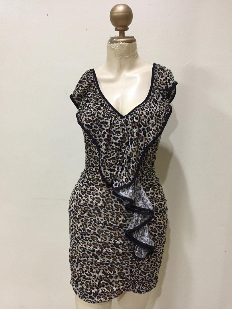 Leopard Print Ruffle Dress (Category: Dresses) located in Quezon City. Submitted by mdmshops (Listing ID 1403126141, Image 1). Description: - Leopard print V-neck dress - Features ruffle detailing - Body-hugging and ruched design - Ideal for special occasions and nights out.