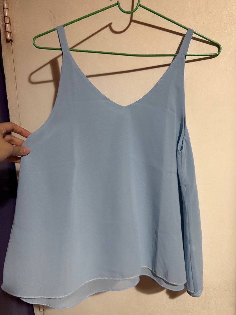 Light Blue Sleeveless Top (Category: Sleeveless) located in Marikina City. Submitted by declutteringera (Listing ID 1403160883, Image 2). Description: - free size - fits up to 36" bust since it's loose - in good condition RFS: decluttering.