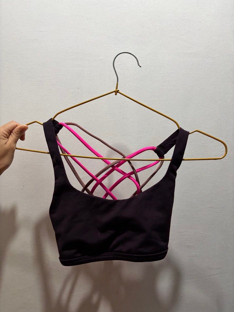 Lululemon Strappy Sports Bra (Category: Activewear) located in Pasay City. Submitted by aisozstudio (Listing ID 1403100548, Image 1). Description: - Lululemon sports bra - Strappy back design - Color: Dark - Neckline: Scoop - Strap Colors: Pink and Brown - Lululemon logo visible - Cannot fit big rib cage. For petite and small lang po RFS: Di na kasya sa akin.