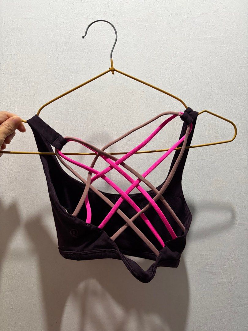 Lululemon Strappy Sports Bra (Category: Activewear) located in Pasay City. Submitted by aisozstudio (Listing ID 1403100548, Image 2). Description: - Lululemon sports bra - Strappy back design - Color: Dark - Neckline: Scoop - Strap Colors: Pink and Brown - Lululemon logo visible - Cannot fit big rib cage. For petite and small lang po RFS: Di na kasya sa akin.