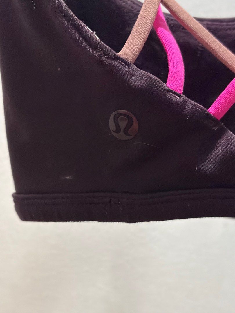 Lululemon Strappy Sports Bra (Category: Activewear) located in Pasay City. Submitted by aisozstudio (Listing ID 1403100548, Image 3). Description: - Lululemon sports bra - Strappy back design - Color: Dark - Neckline: Scoop - Strap Colors: Pink and Brown - Lululemon logo visible - Cannot fit big rib cage. For petite and small lang po RFS: Di na kasya sa akin.
