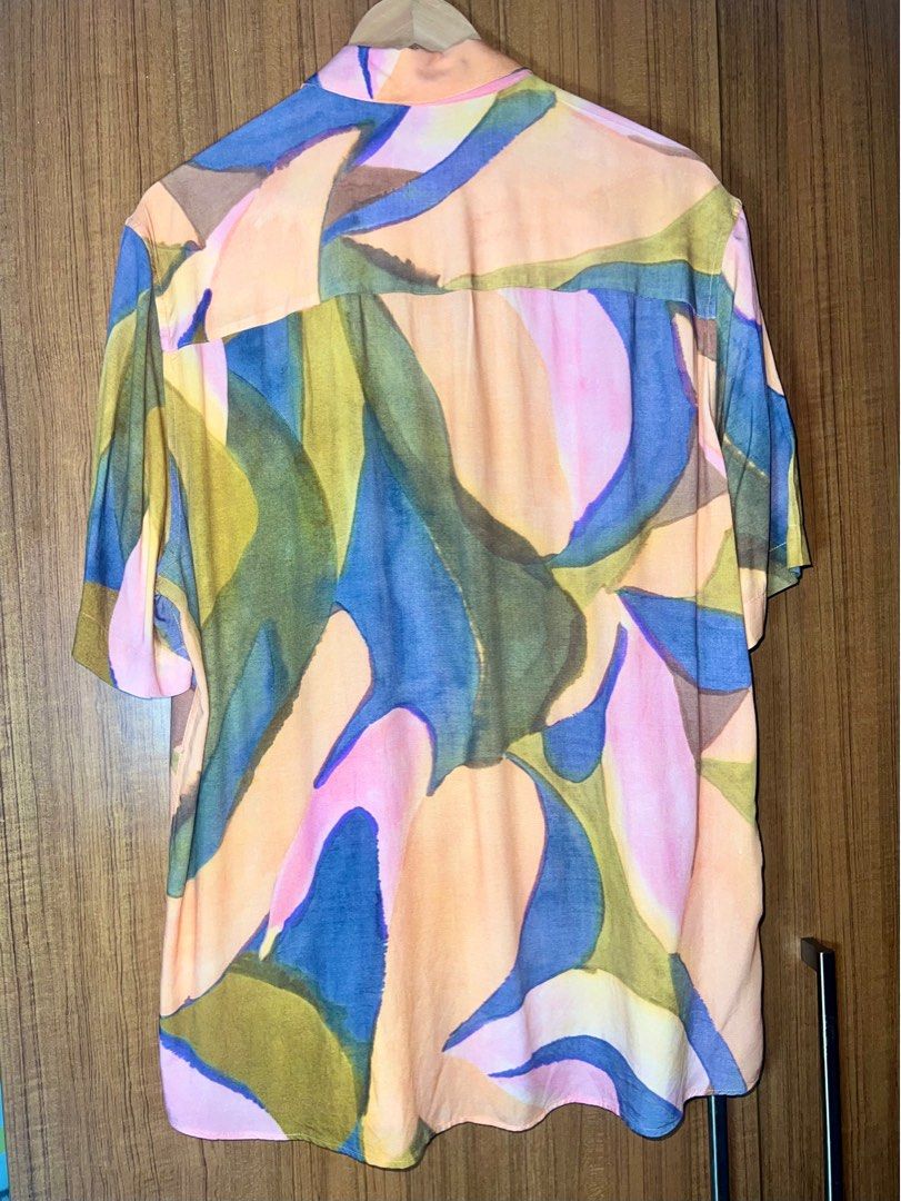 Mango Abstract Print Cuban Polo Shirt (Category: Tshirts & Polo Shirts ) located in Manila. Submitted by drreeves (Listing ID 1403181804, Image 3). Description: - Mango shirt with abstract print - Short sleeves - Classic collar - Regular fit - Button-down closure - Bought for 2k+ pesos - Used only twice; RFS decluttering - Price is negotiable.
