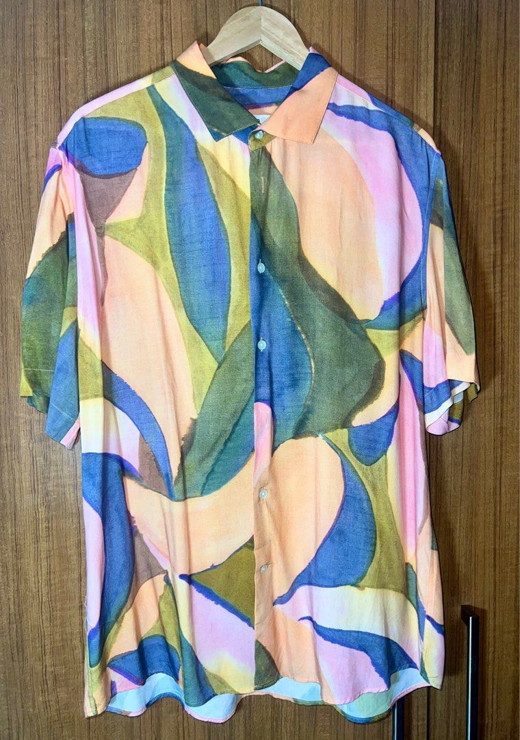 Mango Abstract Print Cuban Polo Shirt (Category: Tshirts & Polo Shirts ) located in Manila. Submitted by drreeves (Listing ID 1403181804, Image 2). Description: - Mango shirt with abstract print - Short sleeves - Classic collar - Regular fit - Button-down closure - Bought for 2k+ pesos - Used only twice; RFS decluttering - Price is negotiable.