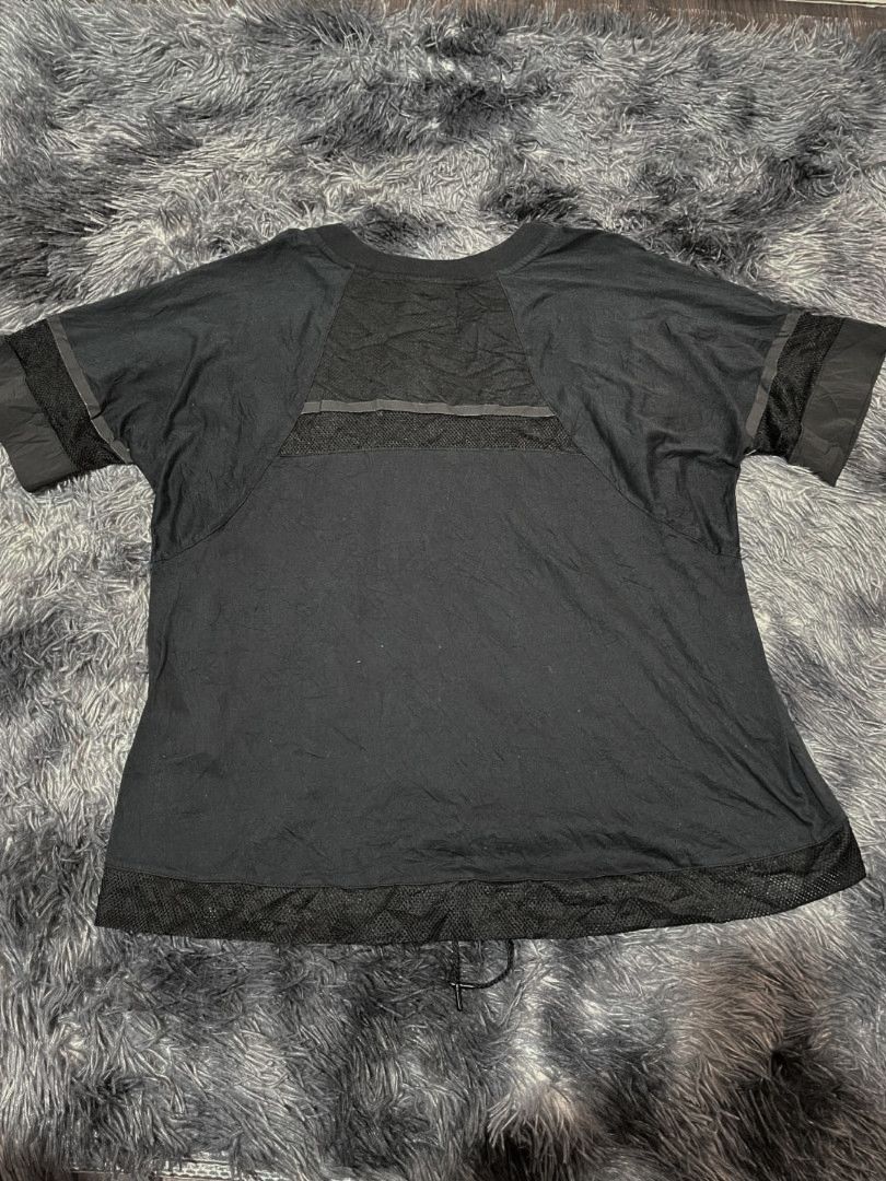 Nike Black Top Mesh for Women (Category: Tshirts & Polo Shirts ) located in Manila. Submitted by jethriftock (Listing ID 1398660916, Image 2). Description: - Black Nike Mesh - Mesh design on sleeves and bottom hem - Small Nike logo on front - Mesh panel across upper back - Round neckline - Short sleeves.