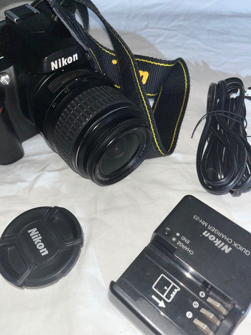 Nikon DSLR Camera with Lens and Charger (Category: Cameras) located in Bongabong. Submitted by theamariano (Listing ID 1403089445, Image 1). Description: Includes: Camera bag, battery, charger, SD card, camera strap, and charging cable - Ready to use - No hidden Issues.