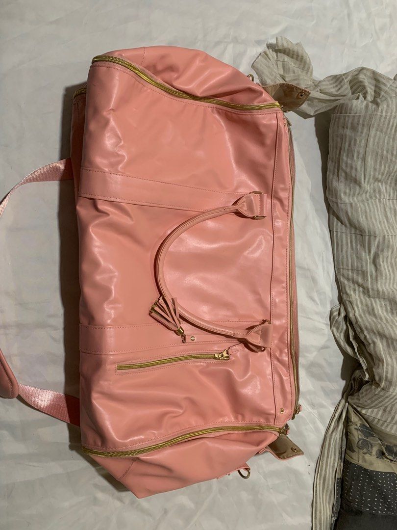 Pink Duffel Travel Bag Pink Foldable (Category: Backpacks) located in Manila. Submitted by seller.13 (Listing ID 1403108433, Image 1). Description: -can fit several clothes -has minimal stains but not visible -used only once.