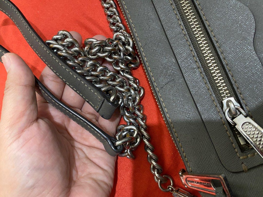 Rebecca Minkoff Gray Sling bag with silver chain strap (Category: Cross-body Bags) located in Iloilo. Submitted by cja_apparel (Listing ID 1403118896, Image 3). Description: Bought this from the US. Ilang years na with me. May crackings lang pero di halata. Magagamit pa. That’s why im selling at a very low price. Quite tarnished na din ang chains..