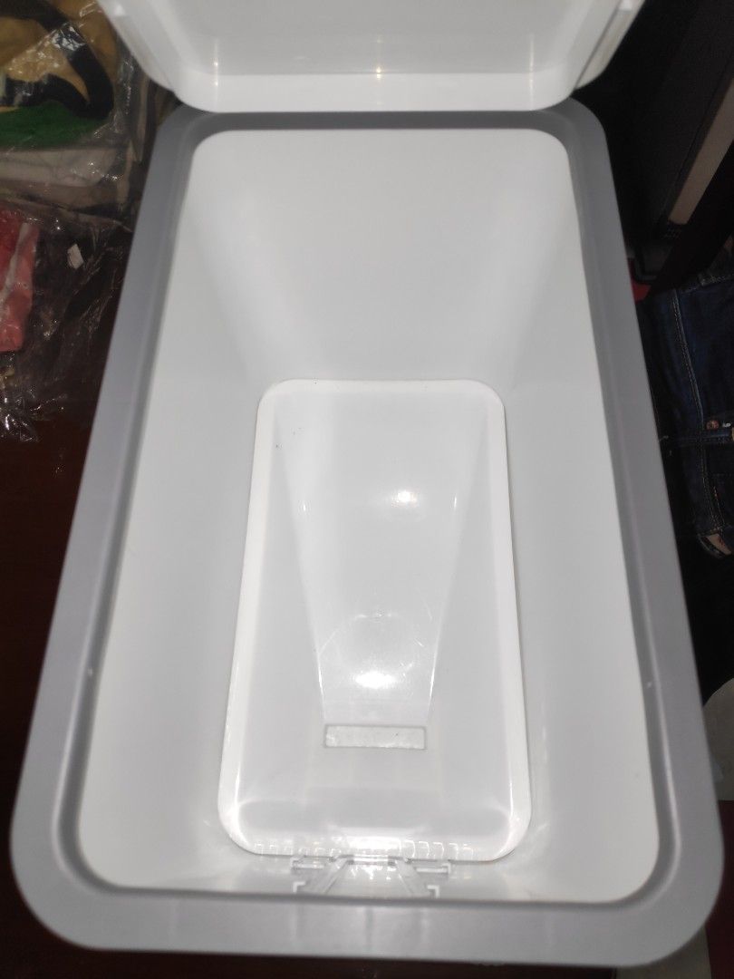 Rice Dispenser with Measuring Cup (Category: Food Organization & Storage) located in Quezon City. Submitted by j.c.declutter (Listing ID 1403072151, Image 2). Description: - Keeps rice fresh and easily accessible. - Features a clear window to monitor rice levels. - Convenient dispensing mechanism. - Includes a measuring cup for precise portions. - Stylish white and gray design. - Durable plastic construction. - Rectangular shape..