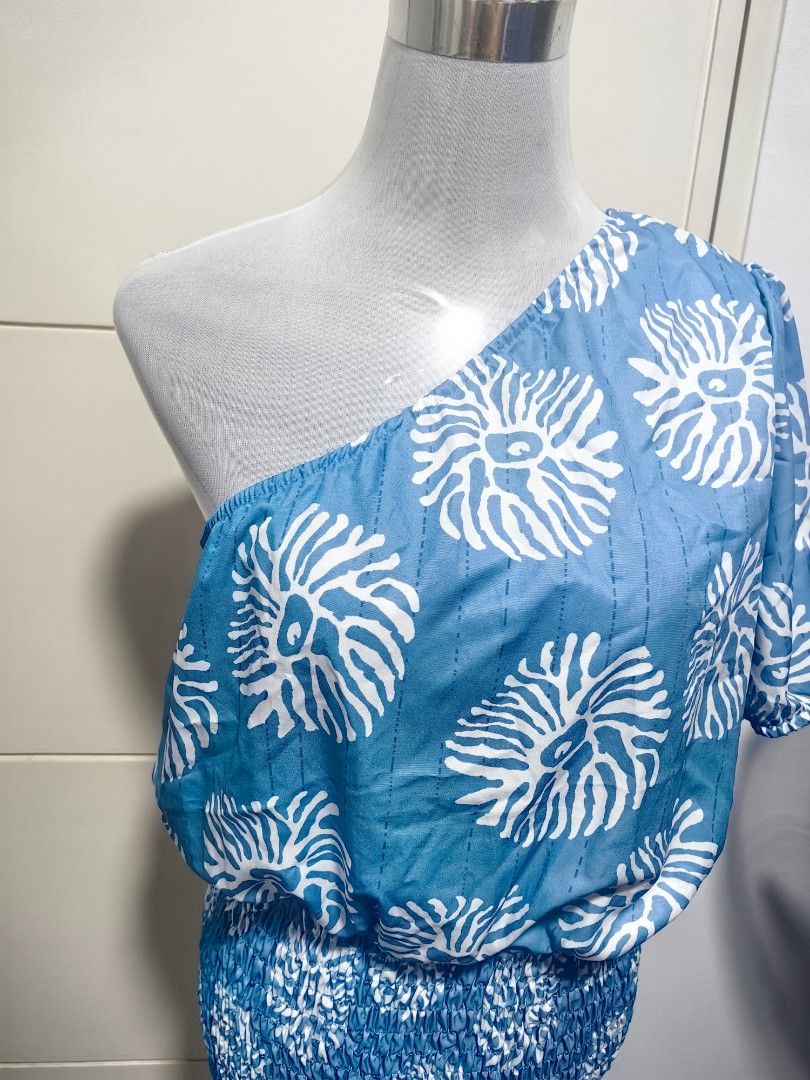 Shein One Shoulder Dress XL (Category: Dresses) located in Quezon City. Submitted by selle_corpus (Listing ID 1403140486, Image 3). Description: - Shein one-shoulder dress - Size: XL - Color: Blue and white pattern - Design: Shirred bodice and skirt - Material: 100% polyester - Half Smocking Dress.