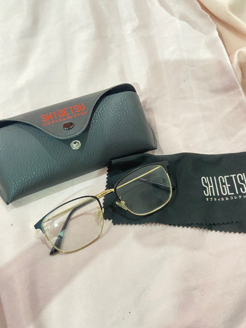 Shigetsu Eyeglasses with Case (Category: Sunglasses & Eyewear) located in Manila. Submitted by 123declutter5 (Listing ID 1403119121, Image 2). Description: - Shigetsu eyeglasses - Gold and black frame - Includes dark gray case with red Shigetsu logo - Includes cleaning cloth with Shigetsu logo Bought this for 350 Selling for 250 RFS: Decluterring.