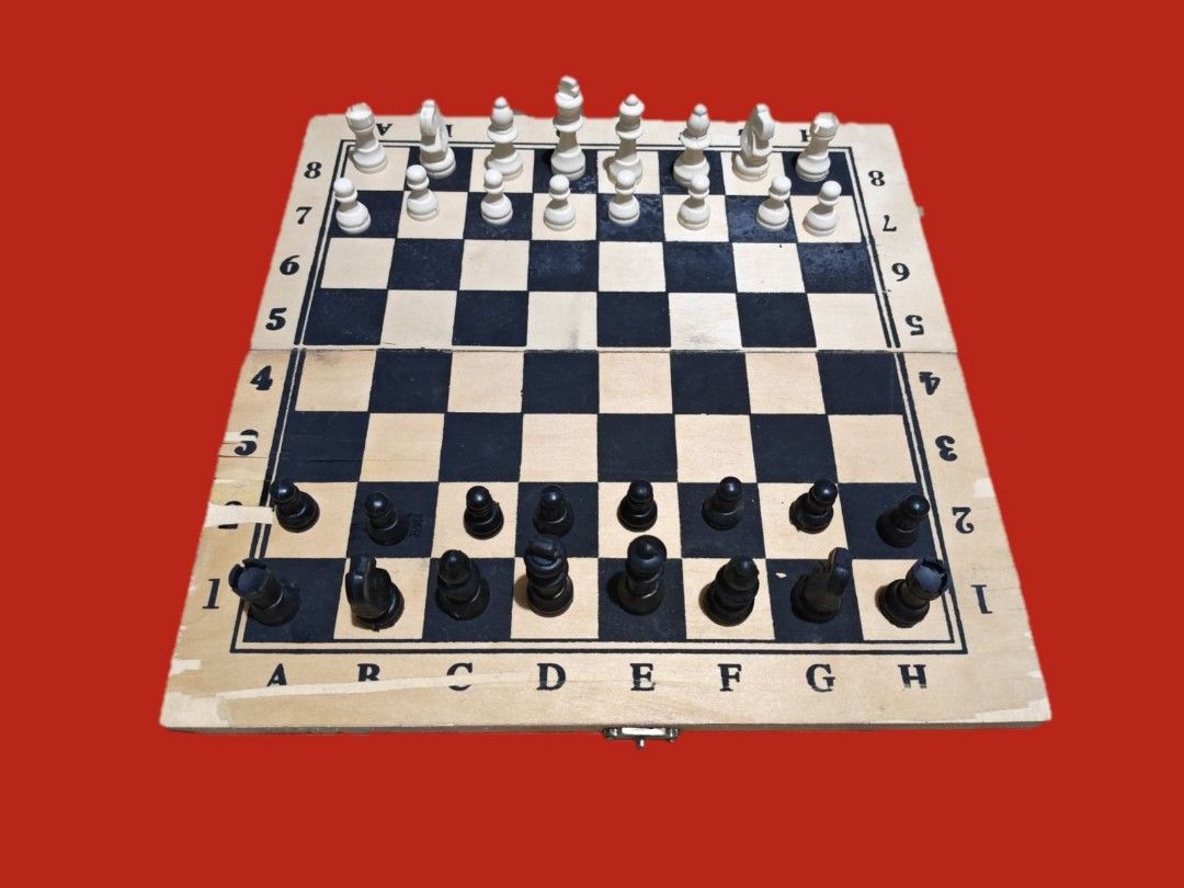 Wooden Chess Set with Pieces (Category: Board Games & Puzzles) located in Marikina City. Submitted by irineb (Listing ID 1403096270, Image 2). Description: 👉🏼good finds!!!👌!!! Wooden chess set - Black and white chess pieces -Size :small - Folding board for compact storage - Pieces stored in individual plastic bags - Board features letter and number markings - Complete set, ready to play visible scaled on sides RFS:decluttering MOP:gcash MOD:fo