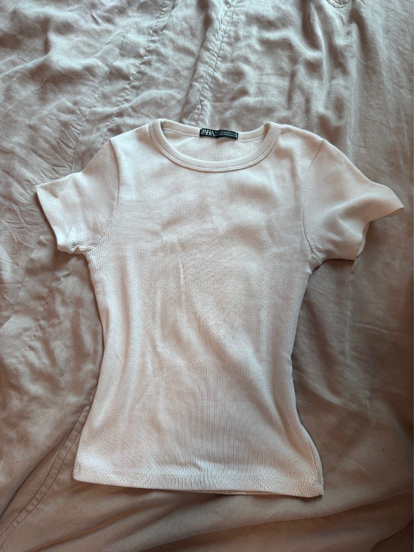 Zara & MERA Ribbed Crop Top (TAKE 3) (Category: Sleeveless) located in Manila. Submitted by hristt (Listing ID 1403096593, Image 1). Description: - Zara ribbed crop top - Crew neck - Short sleeves - Colors: White and Beige - Ribbed material - Perfect for layering or casual wear - Versatile wardrobe piece.