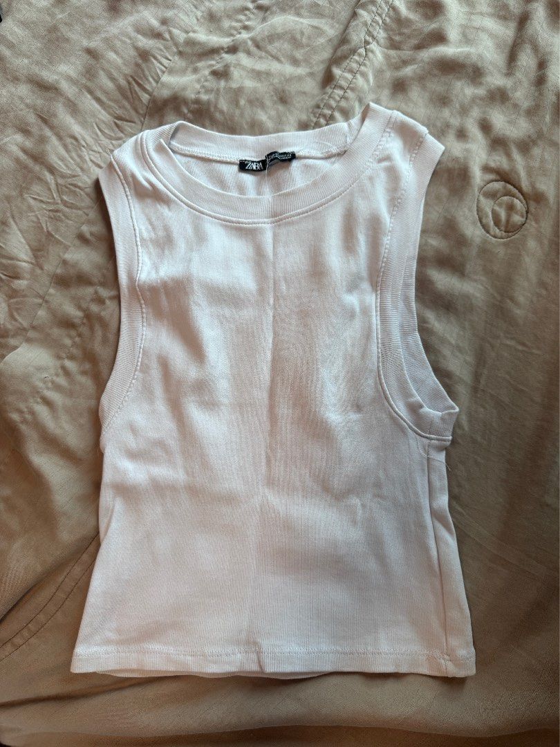 Zara & MERA Ribbed Crop Top (TAKE 3) (Category: Sleeveless) located in Manila. Submitted by hristt (Listing ID 1403096593, Image 3). Description: - Zara ribbed crop top - Crew neck - Short sleeves - Colors: White and Beige - Ribbed material - Perfect for layering or casual wear - Versatile wardrobe piece.
